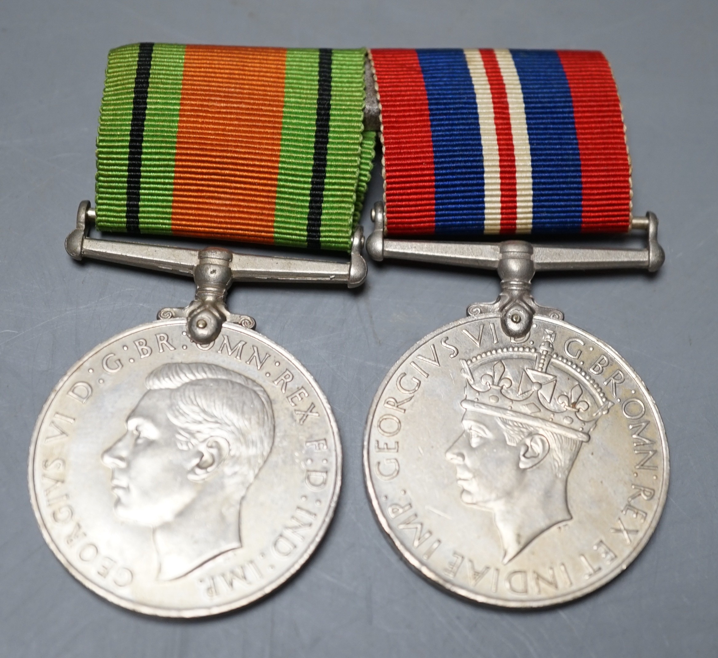 WW2 defence and war medals with miniatures, box of issue named to Flt / Lt M T Judson together with a British pattern sword.